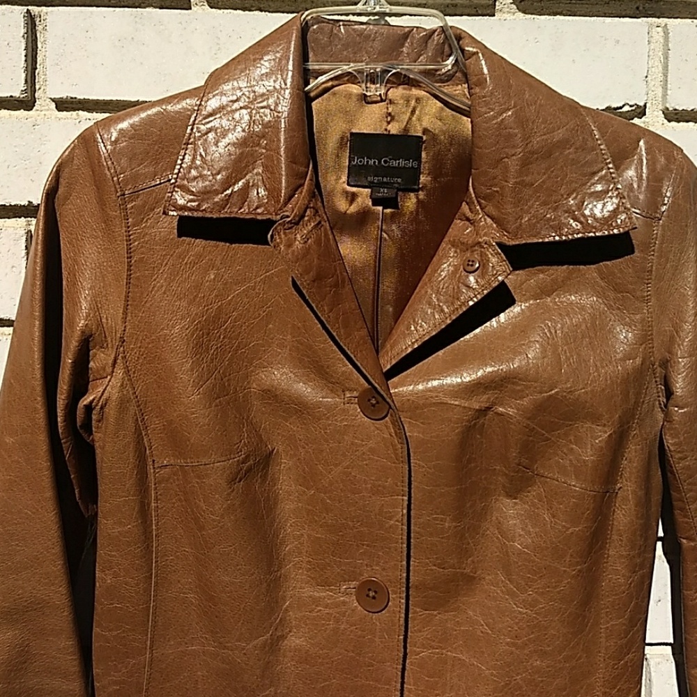 Long brown leather trench coat by John Carlisle.